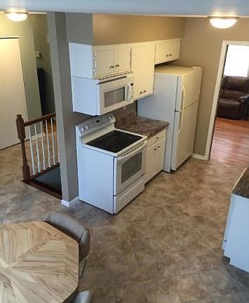 Gorgeous kitchen with new tile floors, counters, updated appliances. Clean and bright!