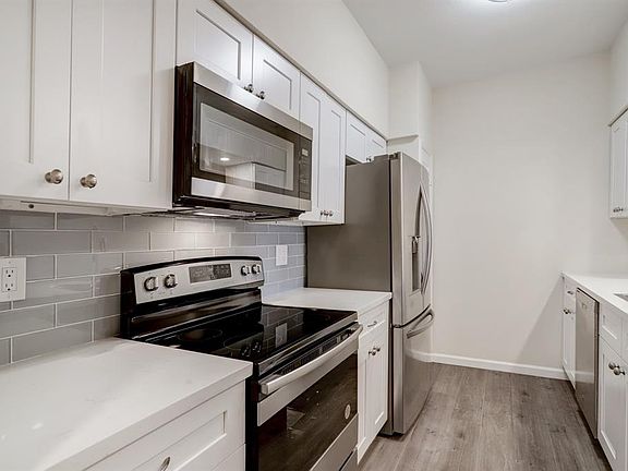 The kitchen features all stainless appliances and brand new backsplash.