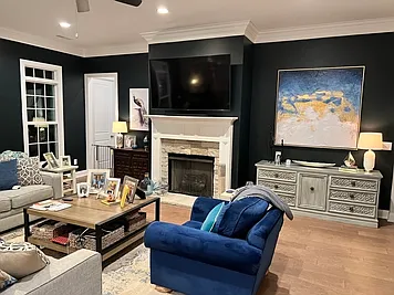 Living room right off of the kitchen with gas fireplace as the centerpiece.