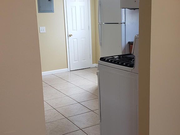 Living room facing towards kitchen