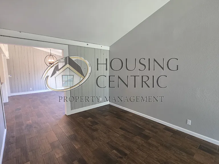 Wood Accent Walls show off this spacious Family and Dining Room!