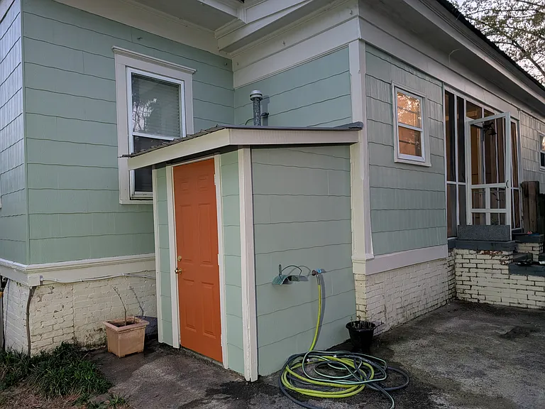 Fenced back yard with space for gardening or entertaining and screened-in patio for mosquito-free evenings.