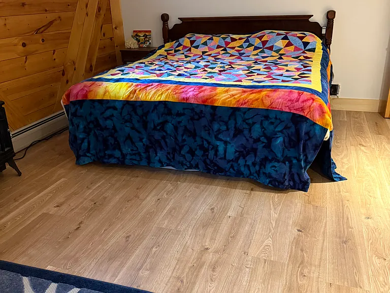 King Bed downstairs in family room.