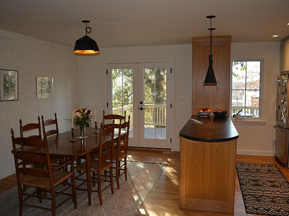 Open layout dining room and kitchen with back porch access