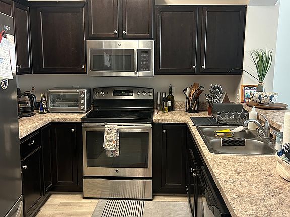 large kitchen with lots of storage and a separate pantry