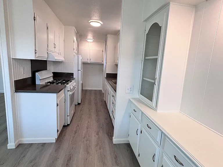 The kitchen is thoughtfully designed to blend functionality with everyday comfort. Featuring ample cabinetry and generous counter space, it provides plenty of room for meal preparation and storage.