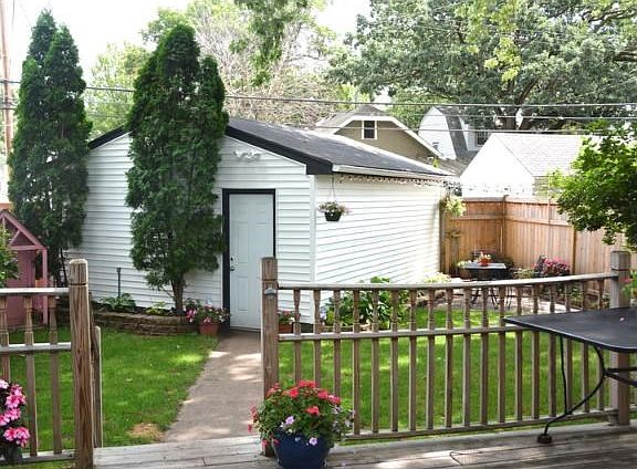 The over-sized garage could maybe hold 2 cars with some modifications? There is also room for additi