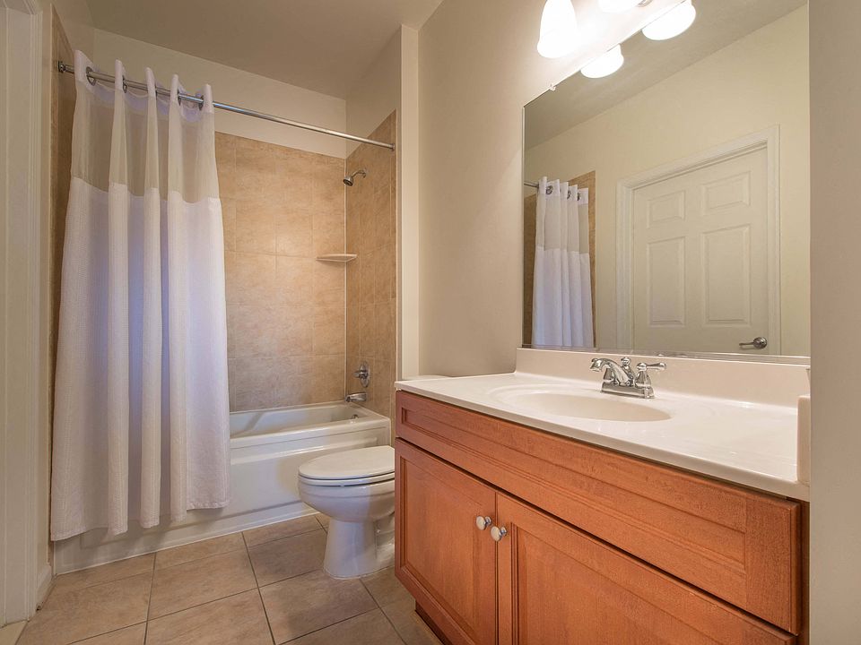 Tiled floor and shower bathrooms with Italian cabinetry and eco-friendly pluming