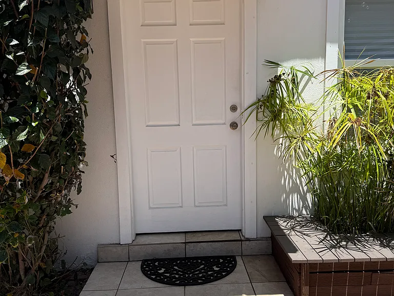 The front door to the cottage is not visible to the public. It's in your very private patio.