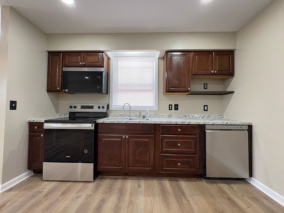 Kitchen new quiet dishwasher, modern advanced microwave, plenty of counter space and cabinet space.