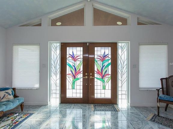Lead glass doors and marble floor. Linen blinds on all 4 foy