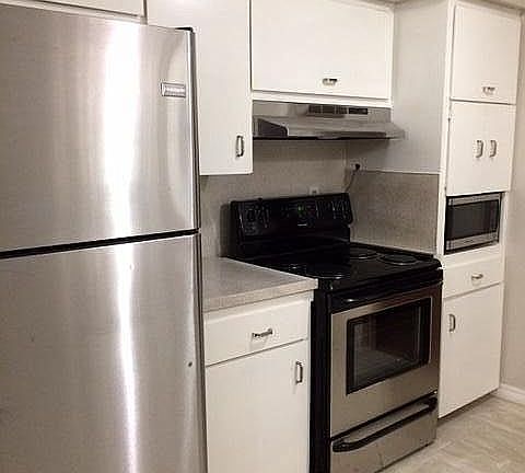 Kitchen-new ref, electric range, range hood