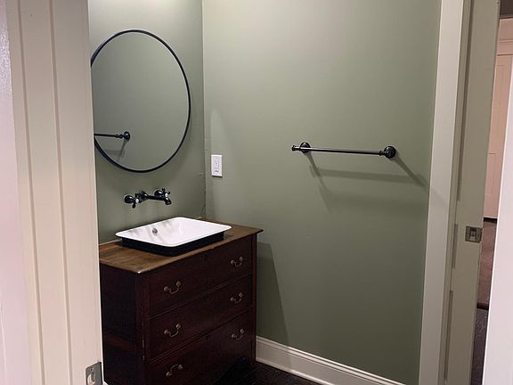 hallway bathroom (powder room with pocket door to shower/tub)