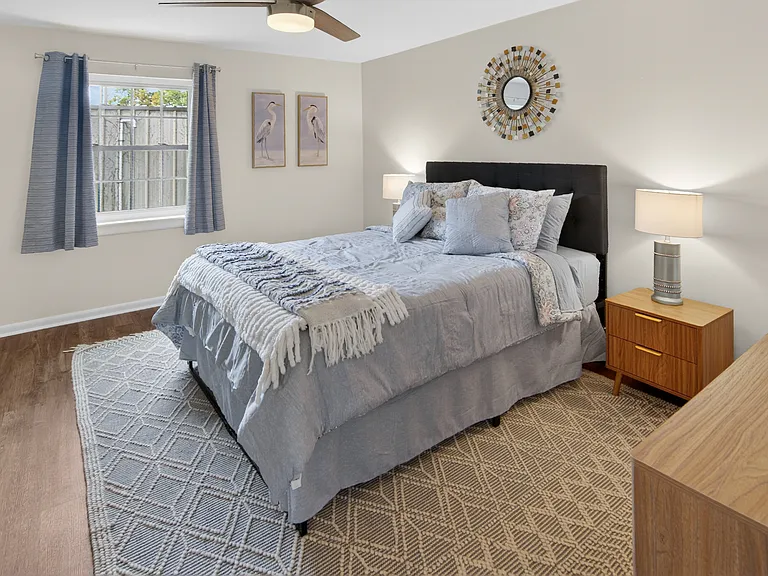 Primary bedroom with two closets. Queen-sized bed