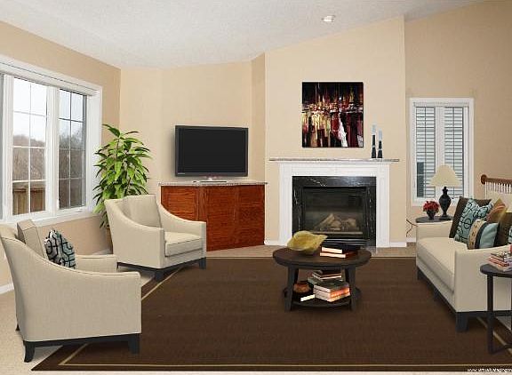 Living room with fireplace, vaulted ceiling and open to the foyer and kitchen/dining room