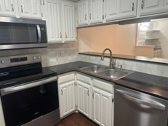 View of kitchen looking into dining room