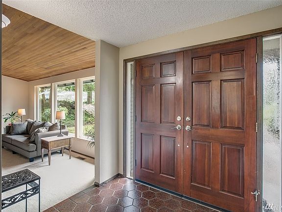 Looking back at the double doors of the entry and a view into the living room. This home is wired for and equipped with a generator - included!