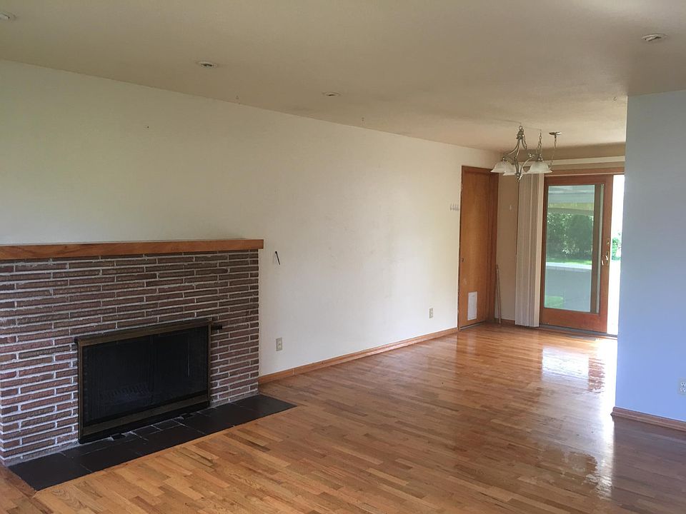 From front door entry. Wood door in photo goes to garage. No