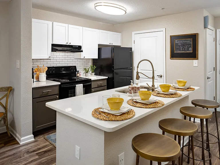 Kitchen with island and bar-style seating