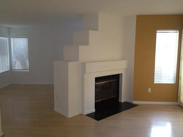 dining area and living room with two sided fireplace