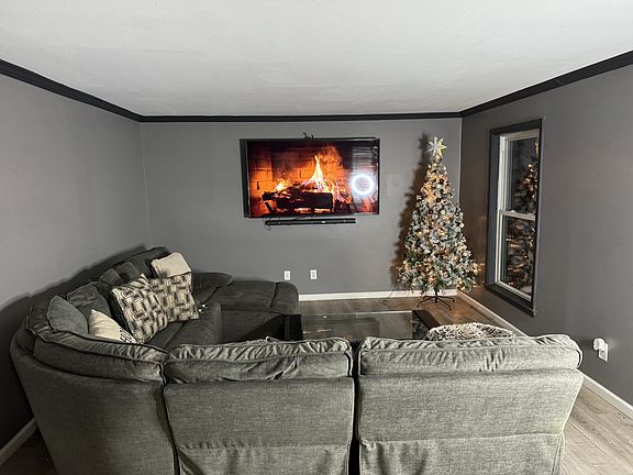 Versatile Formal Living Room with Glass Paned French Doors