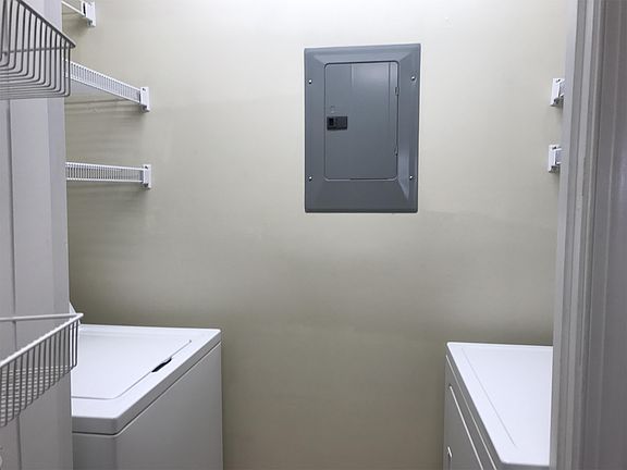Laundry room attached to kitchen
