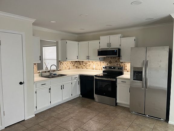 Kitchen Corner with under cabinet lighting, Dishwasher, Microwave, Stove and Oven, Fridge