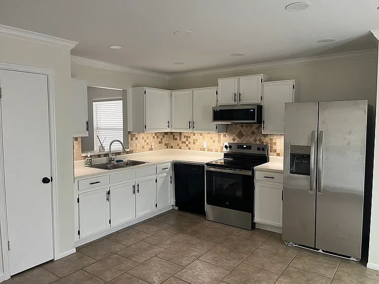 Kitchen Corner with under cabinet lighting, Dishwasher, Microwave, Stove and Oven, Fridge