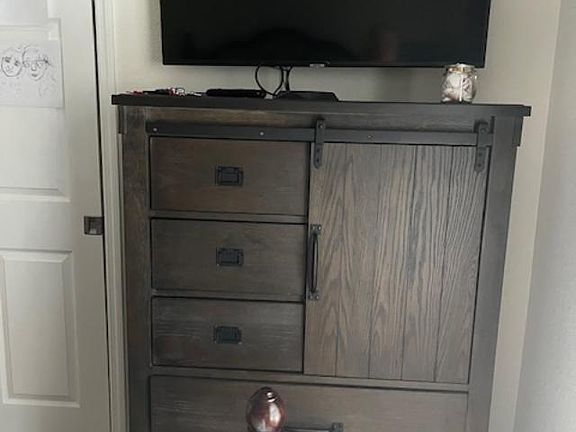 dresser with TV for you to watch