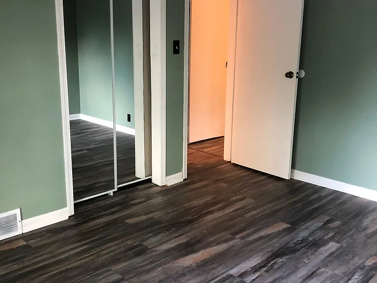 Bedroom with sliding glass door to deck.
