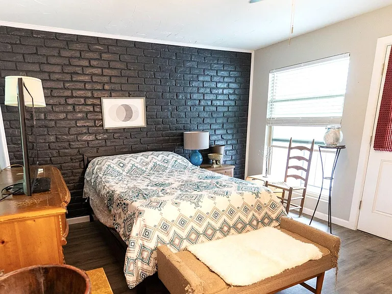 Master bedroom with patio with private patio overlooking outside