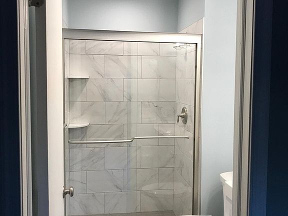 Brand new bathroom with shower alcove connected to Bathroom
