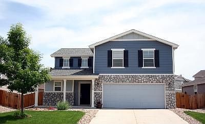 Great looking front of house, with river rocks. 