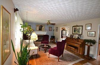 Living Room with Fireplace and Ceiling fan