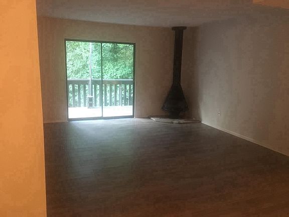 Wooded view from spacious den w/ fireplace!!!