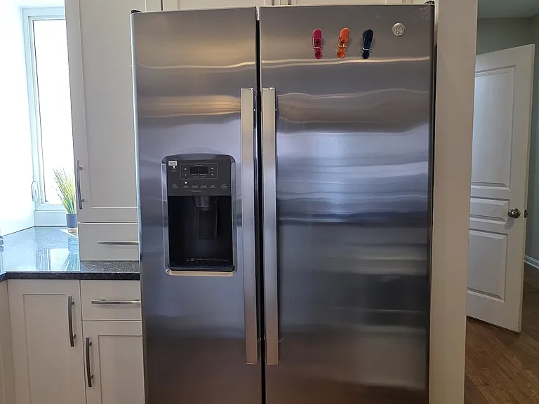 brand new side by side fridge with water and ice dispensor. large fridge
