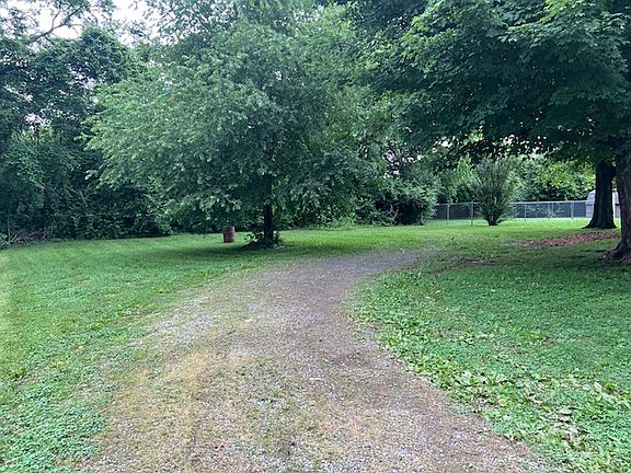 Ample Parking in rear of home with large backyard