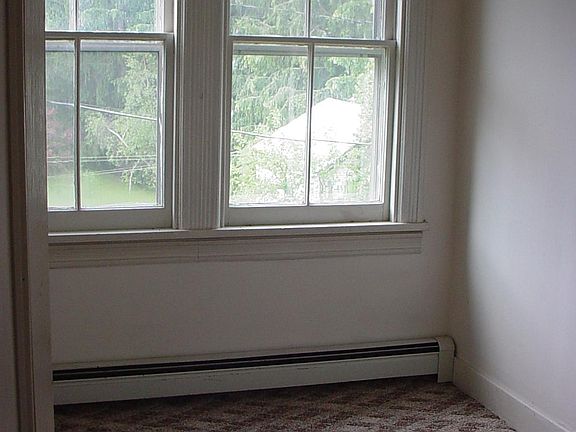 Computer room or treatment room off the main entrance largish wood floored room.