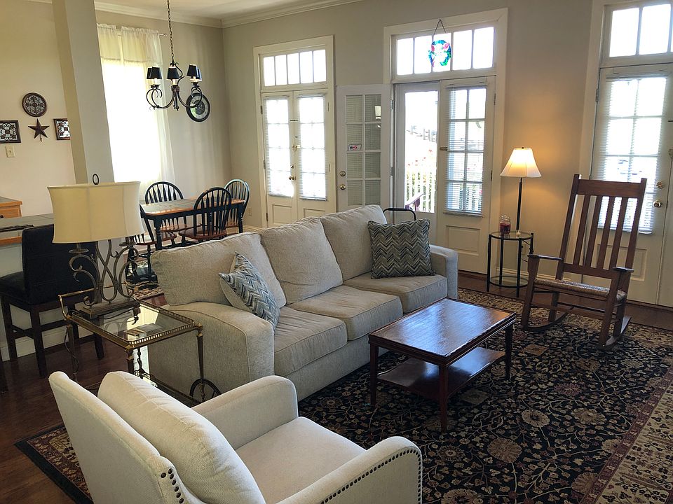 sofa bed. screen door to rocking chair porch