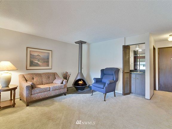 Cozy wood-burning fireplace and fun wet bar.