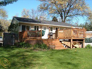 Back of house with deck