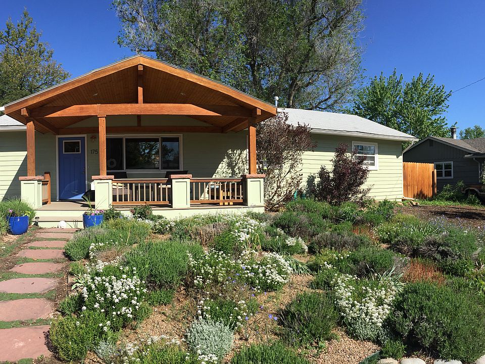 Exterior with front porch, xeriscaped front yard