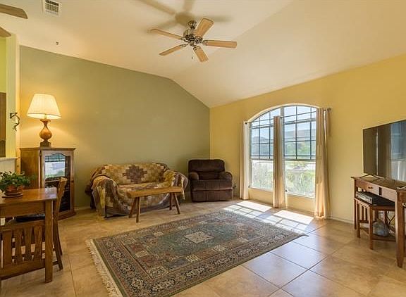 Tile floors and ceiling fans throughout