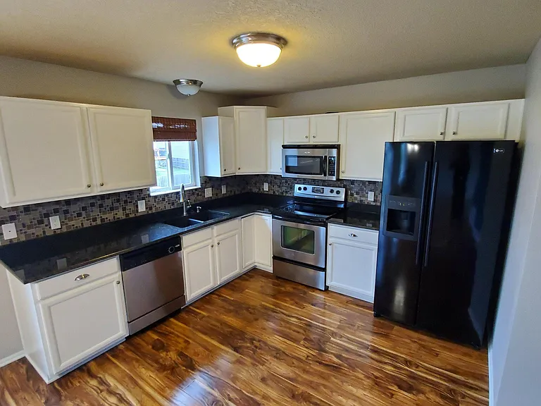 Kitchen (updated cabinets, granite, backsplash)