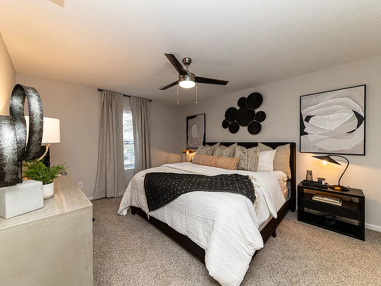 Cozy bedroom with carpet & overhead lighting