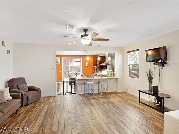 Great room looking towards kitchen & backyard.