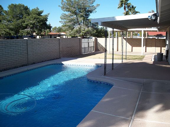 back yard pool and covered rv parking