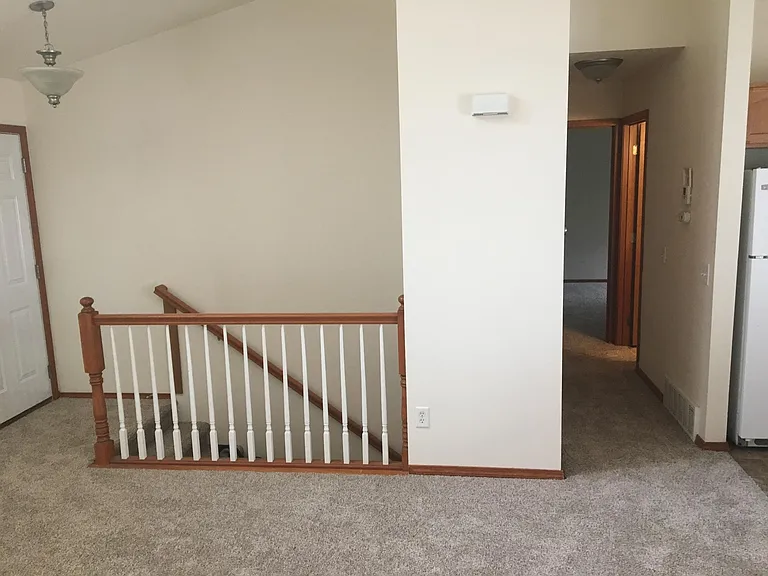 Stairs and hallway to bath and 2 upstairs bedrooms.