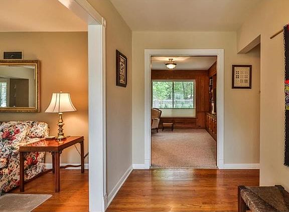 Entry foyer with view of the living room and dining room with family room beyond