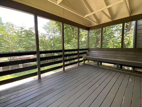 Screened in porch off of kitchen. Enjoy your meals outside. Relax on the porch while being able to see your kids play in yard down below.
